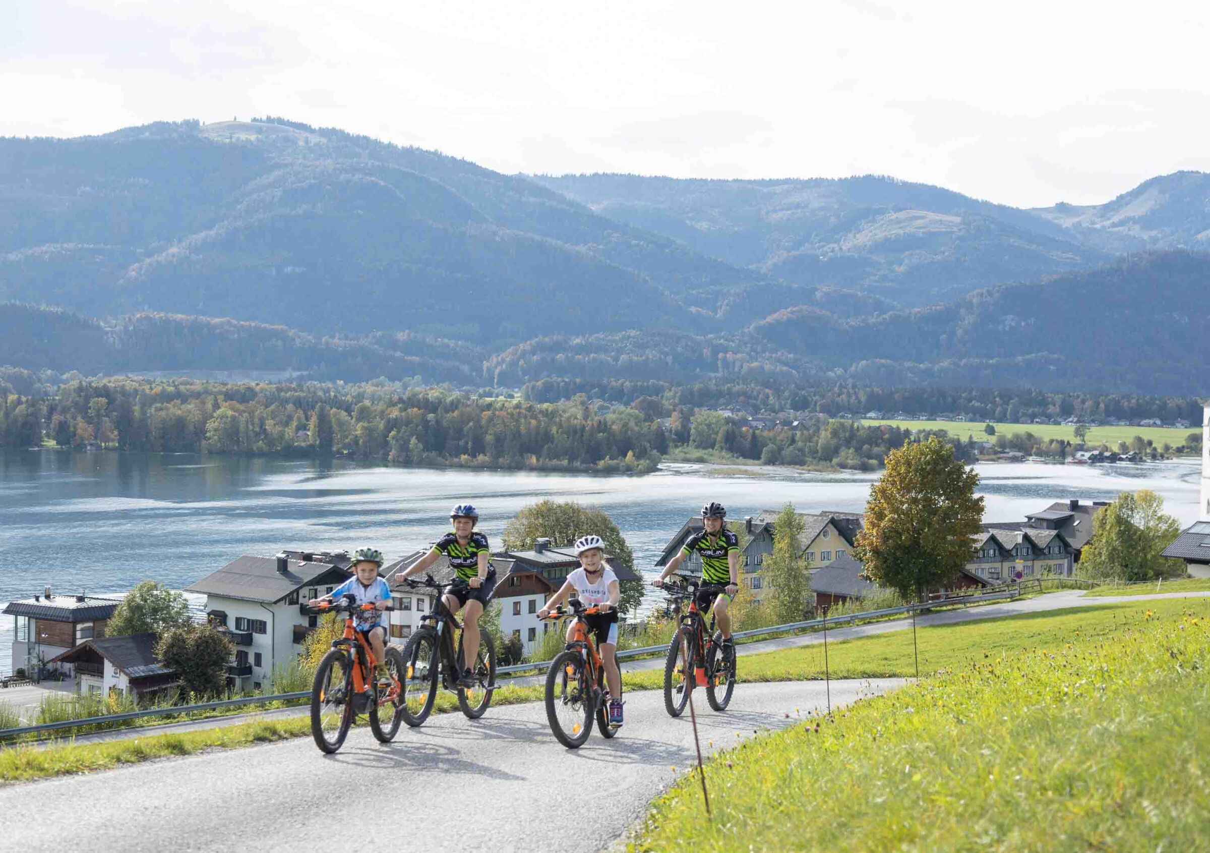 Family cycling at Lake Wolfgangsee in Salzkammergut