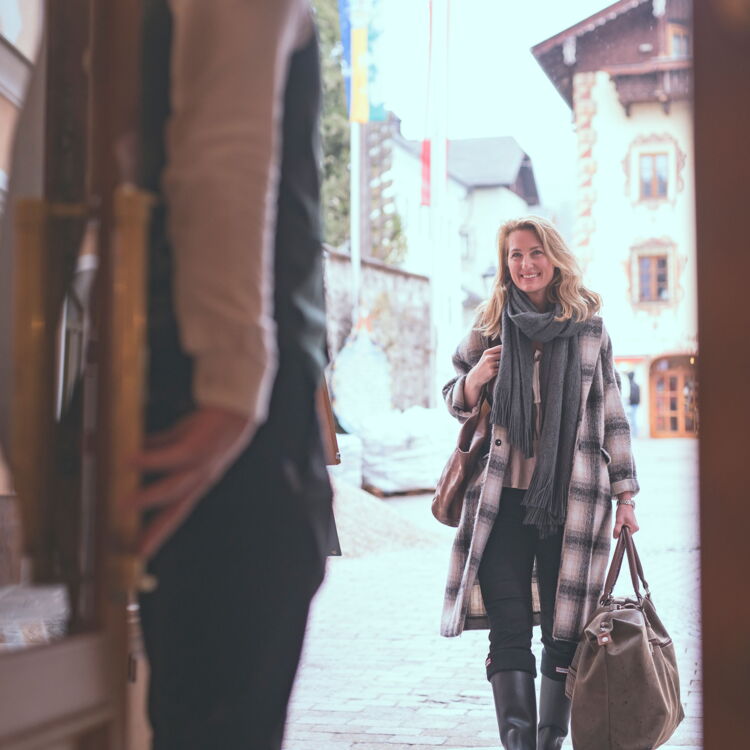A woman on her arrival at Weissen Rössl on Lake Wolfgang