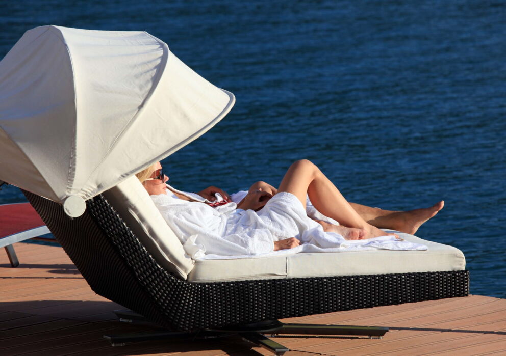Woman sunbathing on the jetty at the Hotel&nbsp;Im Weissen Rössl