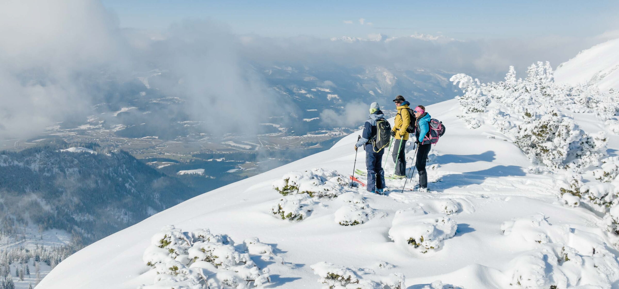 Ski tourers on a snow-covered mountain in Salzkammergut
