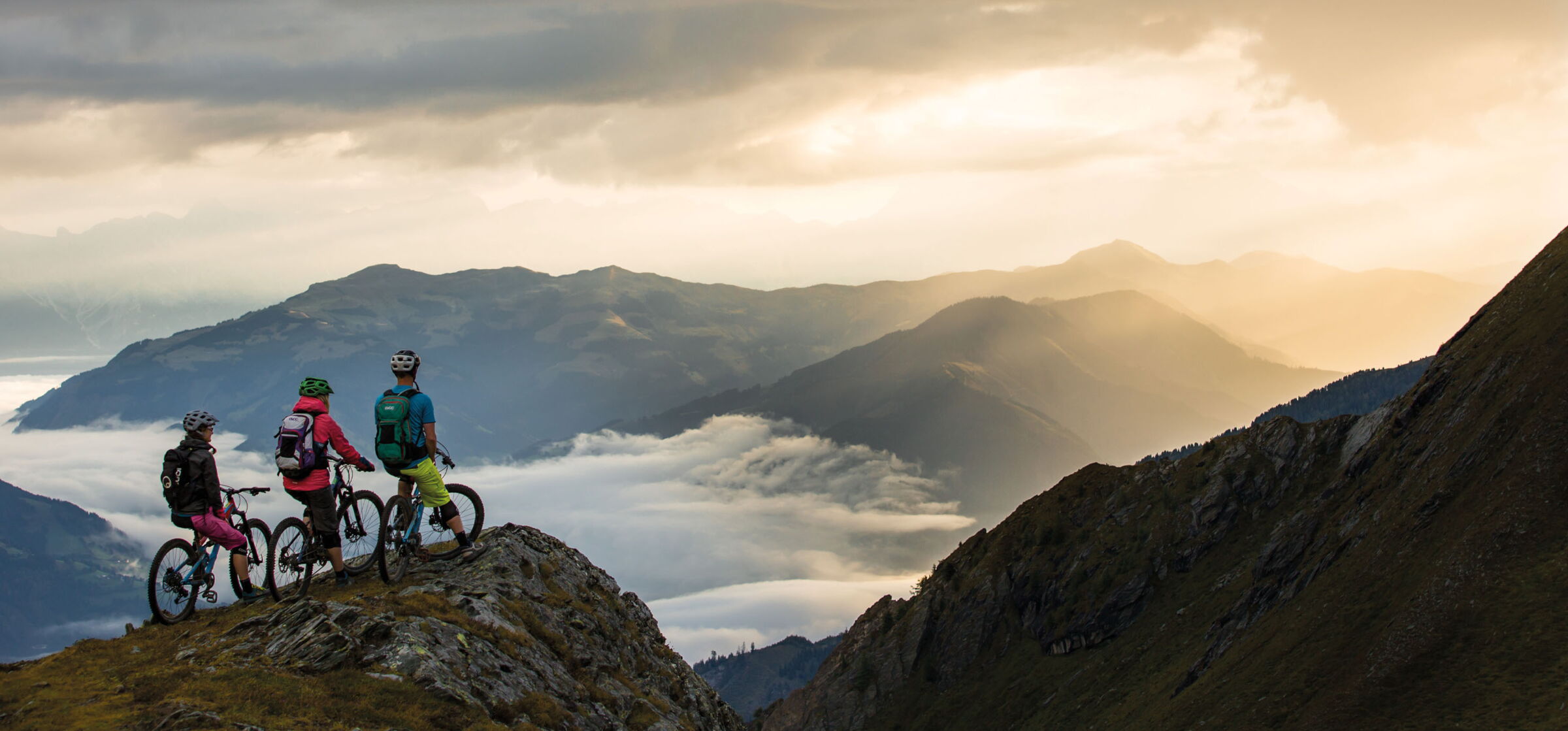 Group of mountain bikers on the summit of a mountain in Salzkammergut
