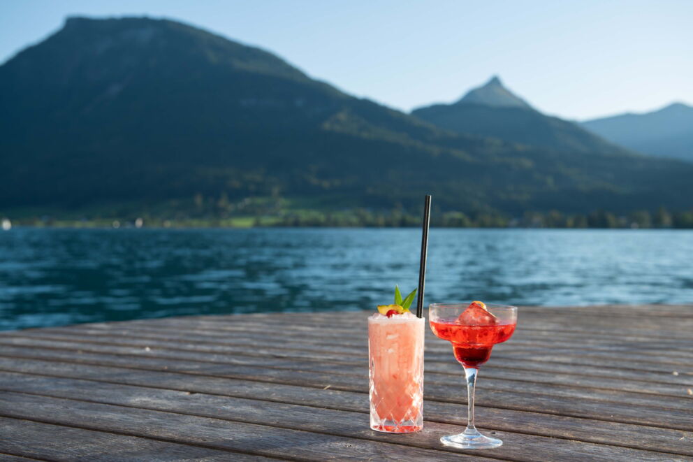 Two cocktails on a jetty at Lake Wolfgang