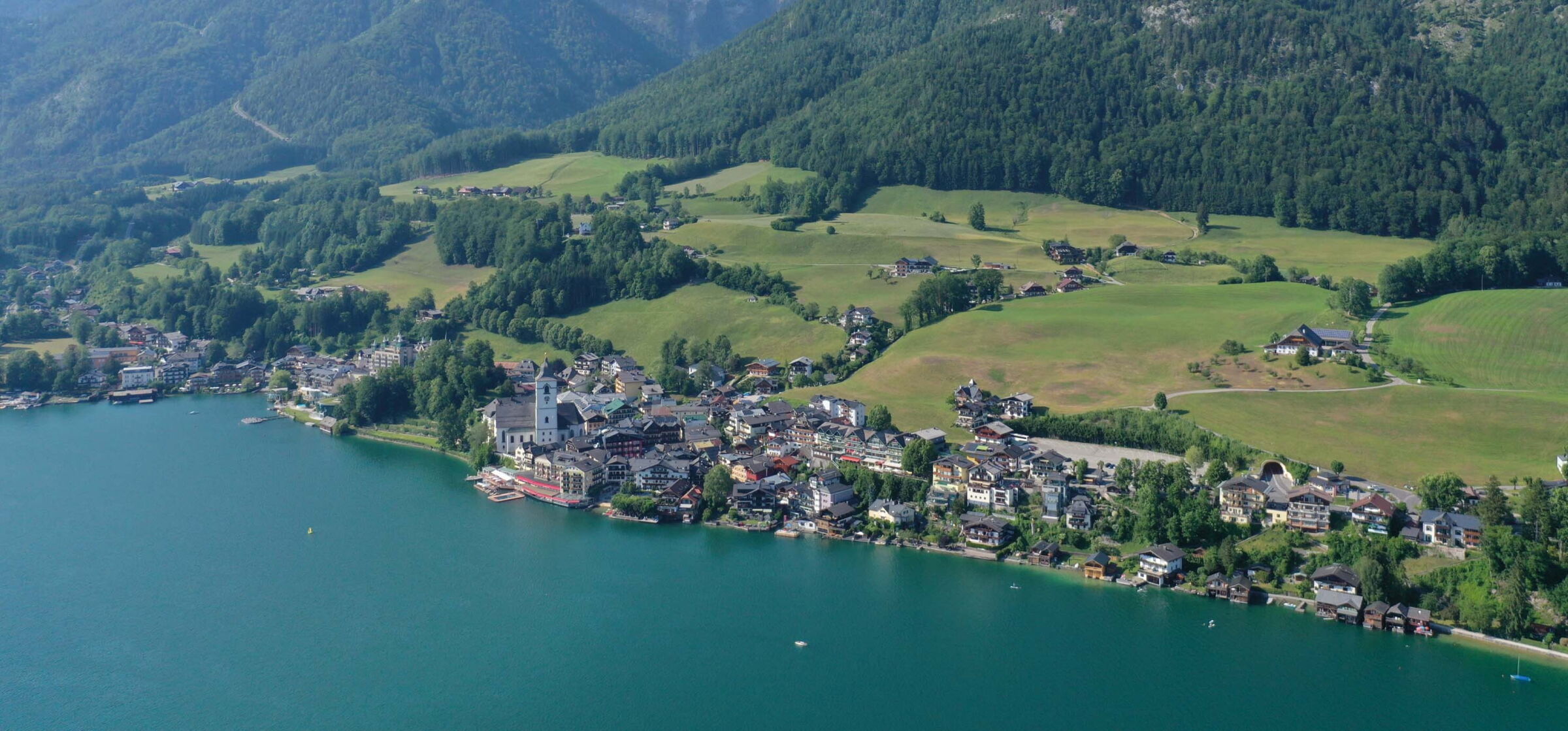 Wide aerial view of the village of Sankt Wolfgang and the Wolfgangsee lake