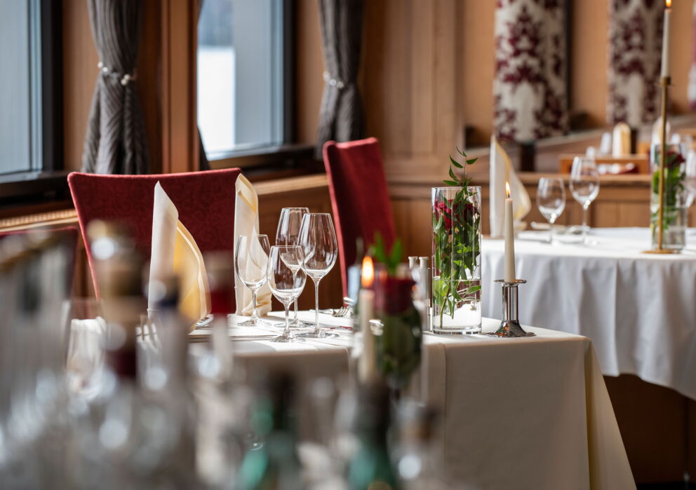 Romantically decorated tables in the restaurant at the Hotel Im Weissen Rössl on Lake Wolfgang