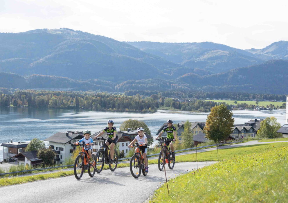 Family cycling at Lake Wolfgangsee in Salzkammergut