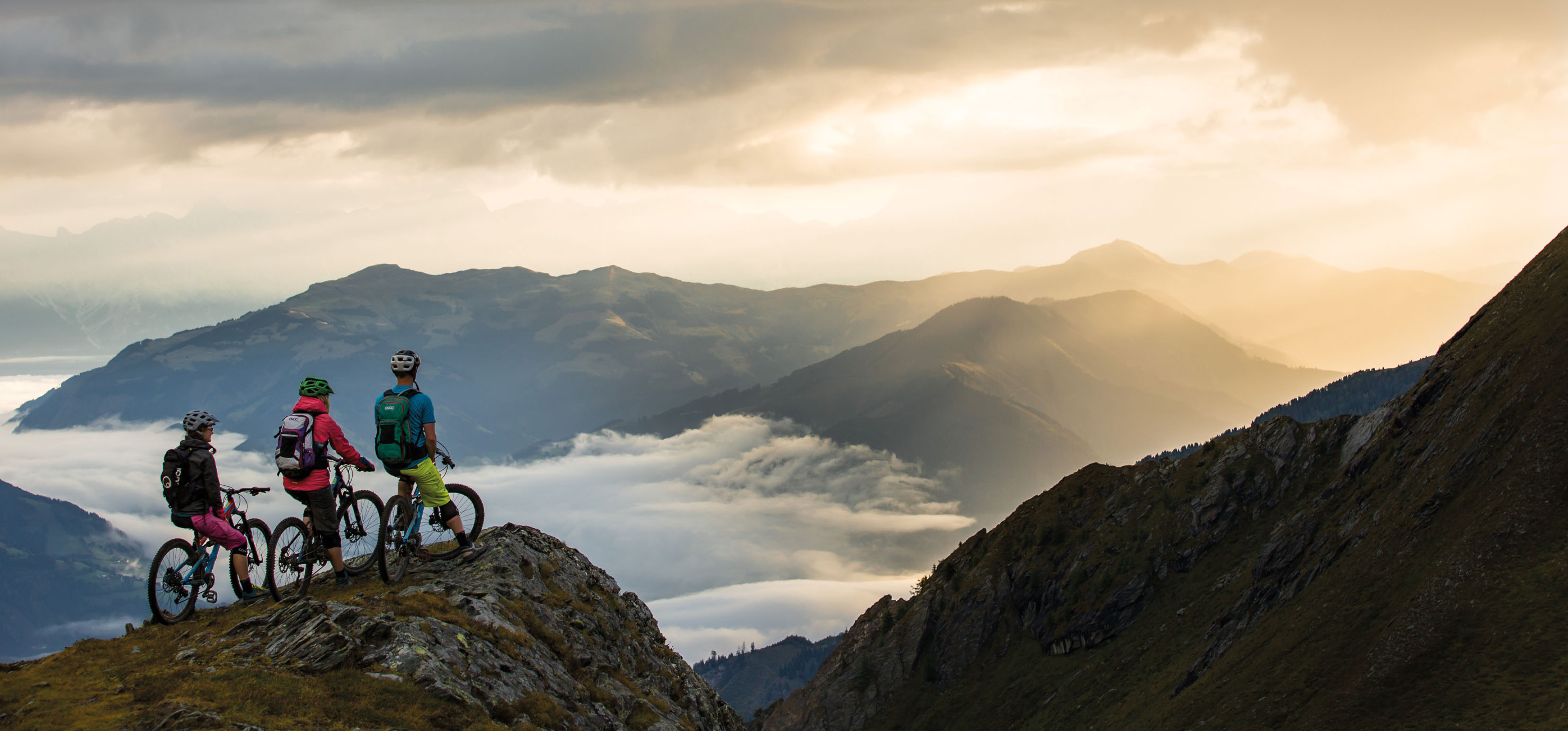 Group of mountain bikers on the summit of a mountain in Salzkammergut