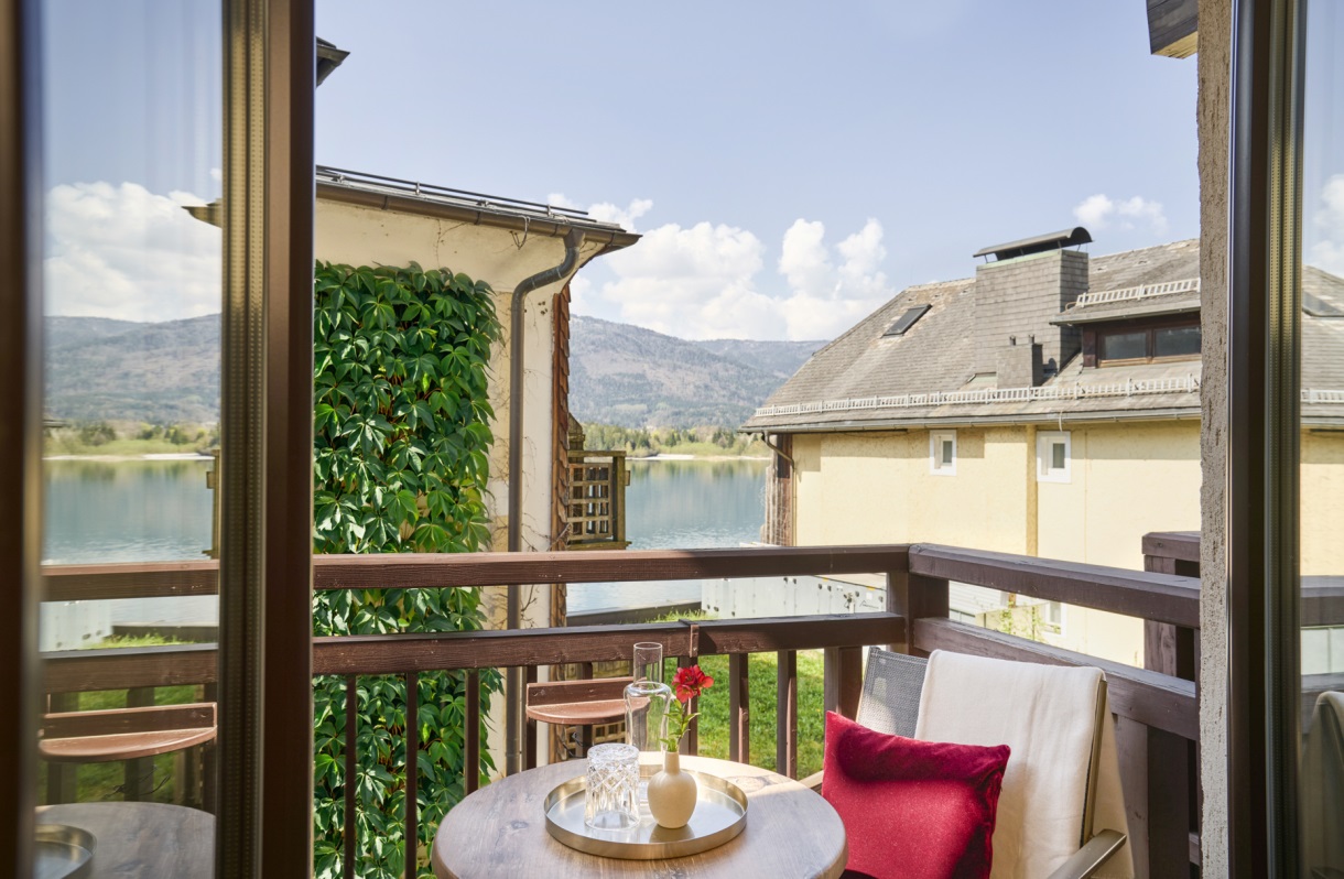 Balcony at the Romantik Hotel Im Weissen Rössl on Lake Wolfgang, with seating and views of Lake Wolfgang